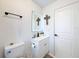 Stylish bathroom featuring a modern vanity, LED mirror, and sophisticated black hardware at 1652 Larkin Rd, Spring Hill, FL 34608