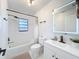 Updated bathroom boasts a shower-tub combo, sleek fixtures, and an LED mirror at 1652 Larkin Rd, Spring Hill, FL 34608
