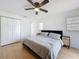 Bedroom with ceiling fan and closet with wooden floor and natural light at 1652 Larkin Rd, Spring Hill, FL 34608