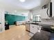 Bright kitchen with stainless steel appliances and an open view to the living room at 1652 Larkin Rd, Spring Hill, FL 34608