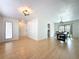 Open-concept living room leads to the dining area with plenty of natural light at 1652 Larkin Rd, Spring Hill, FL 34608