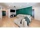 Bright living room features a large gray sectional and a modern light fixture at 1652 Larkin Rd, Spring Hill, FL 34608