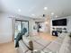 Bright and open living room area leads to a kitchen and outdoor sliding door at 1652 Larkin Rd, Spring Hill, FL 34608