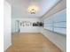 Well-lit living room featuring wood floors, stylish wall decor, and ample natural light at 1652 Larkin Rd, Spring Hill, FL 34608