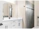 Bathroom featuring a double sink vanity and a large, tiled walk-in shower at 2111 Maximilian Ave, Spring Hill, FL 34609