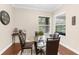 Sunny breakfast nook with seating for four and a view of the outdoors through large windows at 2111 Maximilian Ave, Spring Hill, FL 34609