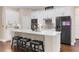 Modern kitchen with a large island, stainless steel appliances, and plenty of cabinet space at 2111 Maximilian Ave, Spring Hill, FL 34609