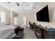 The main bedroom has an electric fireplace and a sitting area, and is neutrally decorated at 2111 Maximilian Ave, Spring Hill, FL 34609