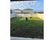 Spacious back yard with lush lawn and a modern swing set for outdoor enjoyment at 22289 Nebula Way, Land O Lakes, FL 34637