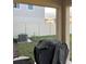 View of a backyard featuring a covered grill and AC unit, offering an outdoor space for cooking at 22289 Nebula Way, Land O Lakes, FL 34637