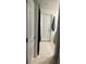 Bathroom featuring a neutral tile floor and a door with a blue towel hanging behind it at 22289 Nebula Way, Land O Lakes, FL 34637