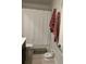 Bathroom with white walls, patterned towels, and a toilet at 22289 Nebula Way, Land O Lakes, FL 34637