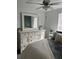 Inviting bedroom features a large dresser, mirror, neutral decor, and comfortable bedding at 22289 Nebula Way, Land O Lakes, FL 34637