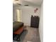 Neutral bedroom featuring a gray dresser, area rug, and wood and steel bench at 22289 Nebula Way, Land O Lakes, FL 34637
