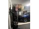 Well-organized garage with shelving, storage containers, and a parked blue SUV at 22289 Nebula Way, Land O Lakes, FL 34637