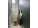 Stylish hallway with dark green accent wall, decor, and high ceilings for grand appearance at 22289 Nebula Way, Land O Lakes, FL 34637