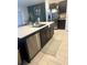 Spacious kitchen island features a stainless steel dishwasher, ample counter space, and a convenient sink at 22289 Nebula Way, Land O Lakes, FL 34637