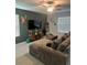 A cozy living room showcases a large sectional, stylish decor, and natural light, creating an inviting atmosphere at 22289 Nebula Way, Land O Lakes, FL 34637
