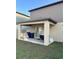 Covered patio area, perfect for relaxing and entertaining with a spot for grilling at 22289 Nebula Way, Land O Lakes, FL 34637