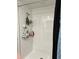 Modern tiled shower with sleek fixtures and convenient storage shelves for toiletries at 22289 Nebula Way, Land O Lakes, FL 34637