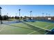 Tennis court offering recreational play in a well-maintained, fenced facility with lights at 22289 Nebula Way, Land O Lakes, FL 34637