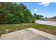 Backyard featuring a fire pit and plenty of green space at 2476 Magellan Ave, Spring Hill, FL 34608