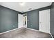 Bedroom with neutral carpet flooring, neutral wall paint, and a view to the home's hallway at 2476 Magellan Ave, Spring Hill, FL 34608