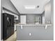 Modern kitchen with granite countertops, breakfast bar, and stainless steel appliances at 2476 Magellan Ave, Spring Hill, FL 34608