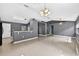 Bright and airy living area boasting an open layout with tile flooring and modern lighting at 2476 Magellan Ave, Spring Hill, FL 34608