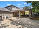 Exterior view of a balcony, covered car port, and beautifully designed backyard at 26221 Pheasant Run, Wesley Chapel, FL 33544