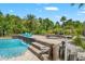 Stunning backyard with beautiful pool, brick pavers and outdoor lounge area, perfect for relaxation at 26221 Pheasant Run, Wesley Chapel, FL 33544