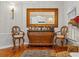 Stylish bar area with ornate mirror, wooden bar, and comfortable seating at 26221 Pheasant Run, Wesley Chapel, FL 33544