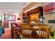 Custom wet bar with a full assortment of liquor, custom lighting, barstools, and unique decor at 26221 Pheasant Run, Wesley Chapel, FL 33544