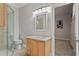 Elegant bathroom with vanity, toilet, and glass shower, creating a spa-like atmosphere at 26221 Pheasant Run, Wesley Chapel, FL 33544