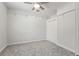 A well-lit bedroom with closet and shelf, offering ample storage and organization at 26221 Pheasant Run, Wesley Chapel, FL 33544