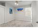 Bright bedroom with neutral tones, featuring artwork and a window with natural light at 26221 Pheasant Run, Wesley Chapel, FL 33544