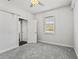 Bedroom with natural light, featuring modern window, and open bathroom view at 26221 Pheasant Run, Wesley Chapel, FL 33544