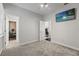 A serene bedroom with soft grey carpet and a TV, offering a peaceful retreat at 26221 Pheasant Run, Wesley Chapel, FL 33544