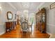 Elegant dining room with chandelier, formal dining set, and classic architectural details at 26221 Pheasant Run, Wesley Chapel, FL 33544