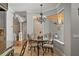 Elegant dining room featuring a chandelier and views to the outside at 26221 Pheasant Run, Wesley Chapel, FL 33544