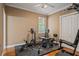 Home exercise room featuring weights, a bench, and a variety of fitness equipment on a rubber floor at 26221 Pheasant Run, Wesley Chapel, FL 33544