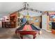 Spacious game room featuring a pool table, dart machine, and sports decorations at 26221 Pheasant Run, Wesley Chapel, FL 33544