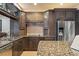 Beautiful kitchen featuring granite countertops, stainless steel appliances, and ample cabinetry at 26221 Pheasant Run, Wesley Chapel, FL 33544