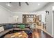 Open floor plan living room with hardwood floors and seamless kitchen views at 26221 Pheasant Run, Wesley Chapel, FL 33544