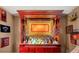 A custom wet bar with an array of bottles and glasses displayed on the bar at 26221 Pheasant Run, Wesley Chapel, FL 33544