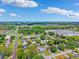 An aerial view of a residential neighborhood near power lines and a body of water at 3204 Payne St, New Port Richey, FL 34655