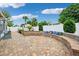 Large backyard with brick pavers, ample seating, and a well-maintained white privacy fence at 3204 Payne St, New Port Richey, FL 34655