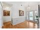 Inviting foyer with beautiful hardwood floors, decorative lighting, and an elegant front door at 3204 Payne St, New Port Richey, FL 34655