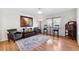Cozy living room featuring hardwood floors, stylish furnishings, and plenty of natural light from the window at 3204 Payne St, New Port Richey, FL 34655