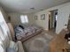 Comfortable bedroom with patterned bedding, dresser, and ensuite access at 3252 Columbus Dr, Holiday, FL 34691